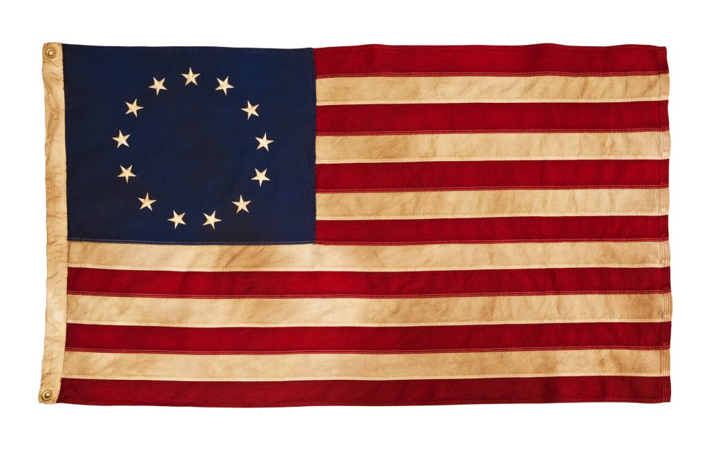 This American Colonial Flag, popularly attributed to Betsy Ross, was designed during the American Revolutionary War features 13 stars to represent the original 13 colonies. According to the legend, the original Betsy Ross flag was made on July 4, 1776.